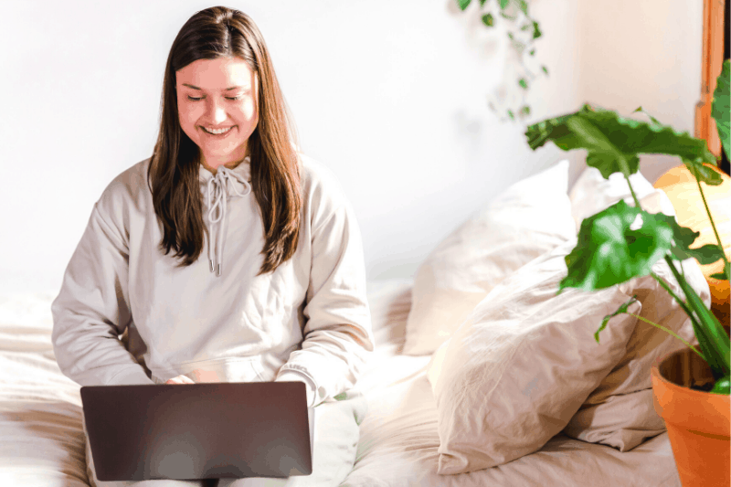 woman blogging on laptop computer